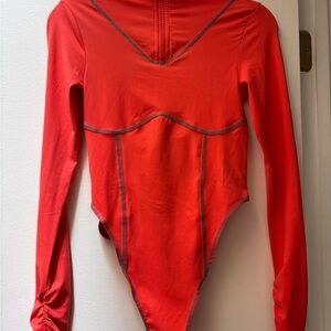 Orange and teal stitch Long Sleeve Bodysuit